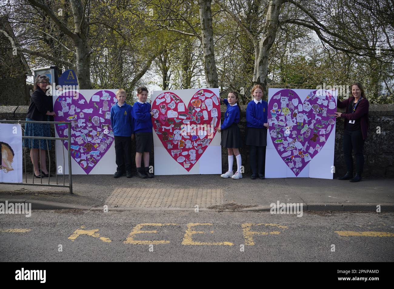 Pupils and teachers from Aldington Primary School pay their respects to