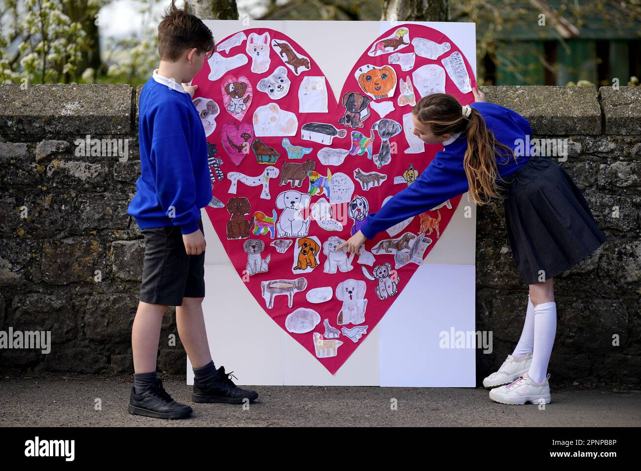 Pupils from Aldington Primary School pay their respects to Paul O'Grady
