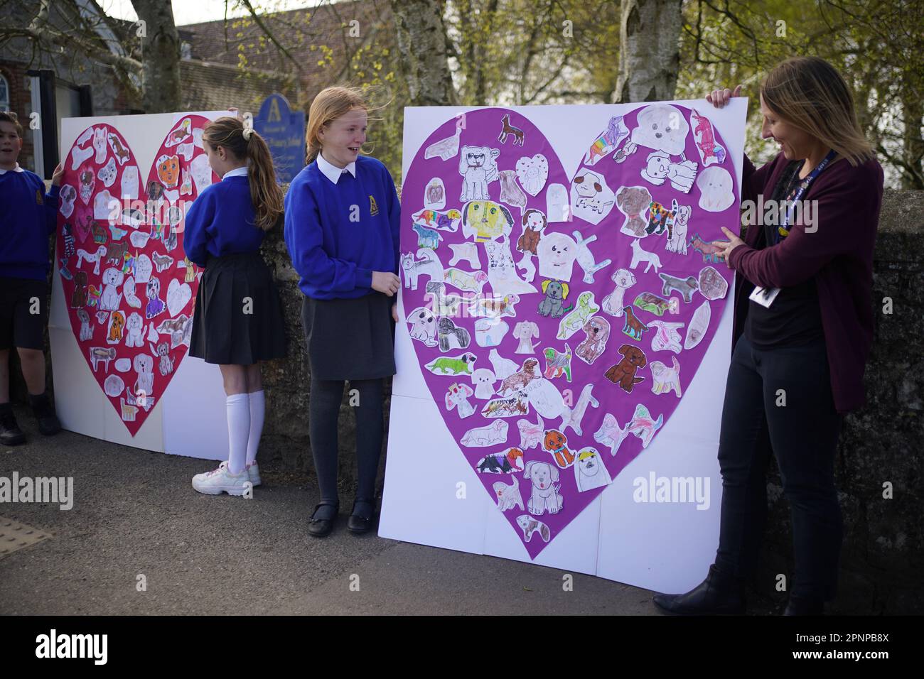Pupils and teachers from Aldington Primary School pay their respects to