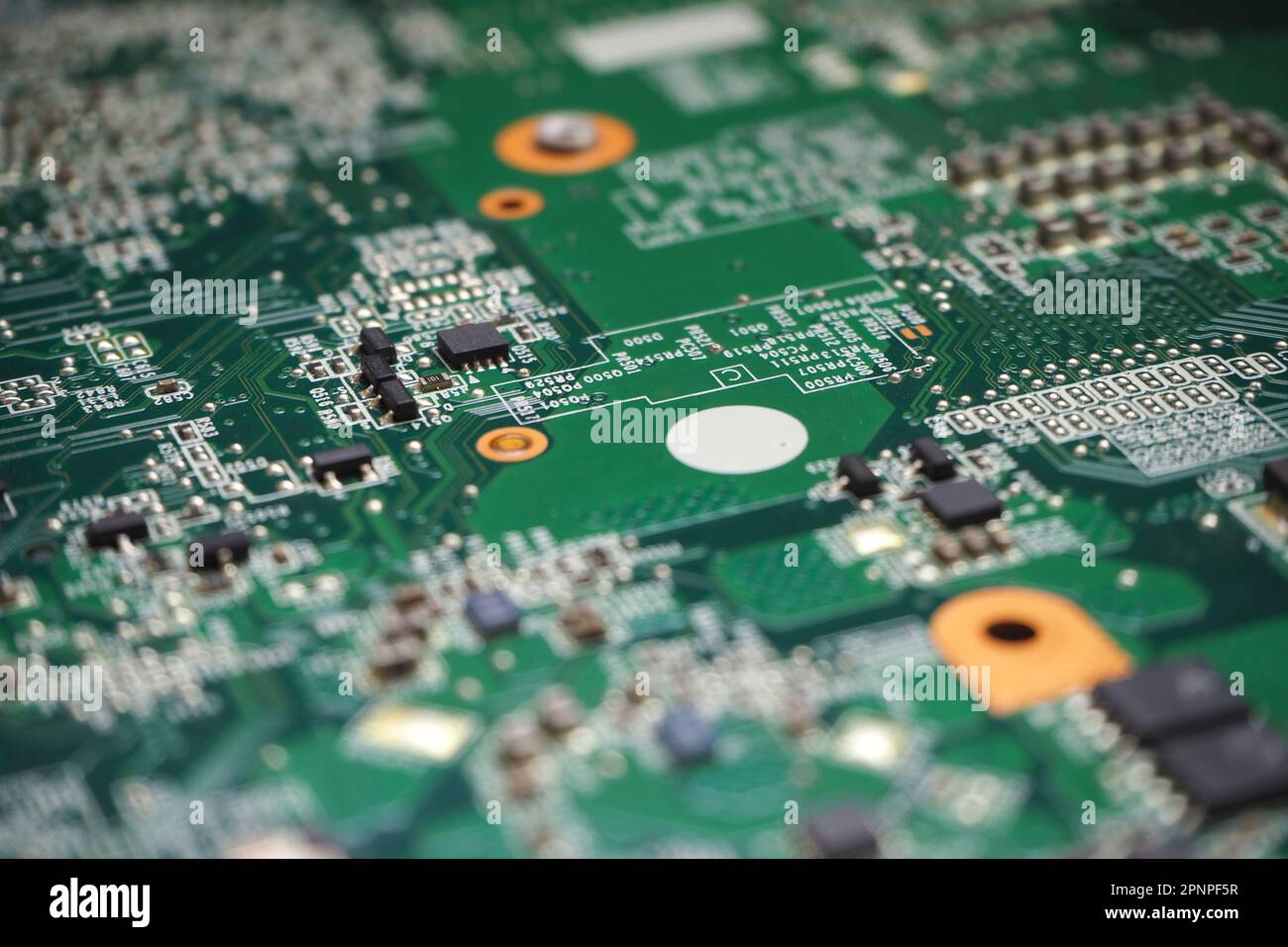 Close up of semiconductor components on electronic circuit board. High