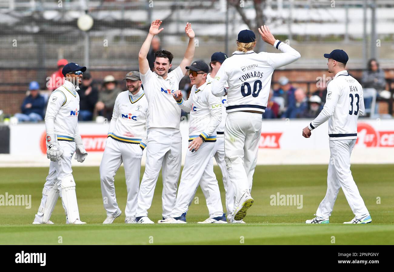 Hove UK 20th April 2023 -  Yorkshire bowler Jordan Thompson throws his arms in the air as he celebrates taking the wicket of Sussex's Alistair Orr for 20 runs during the LV= Insurance County Championship cricket match at the 1st Central County Ground in Hove : Credit Simon Dack /TPI/ Alamy Live News Stock Photo