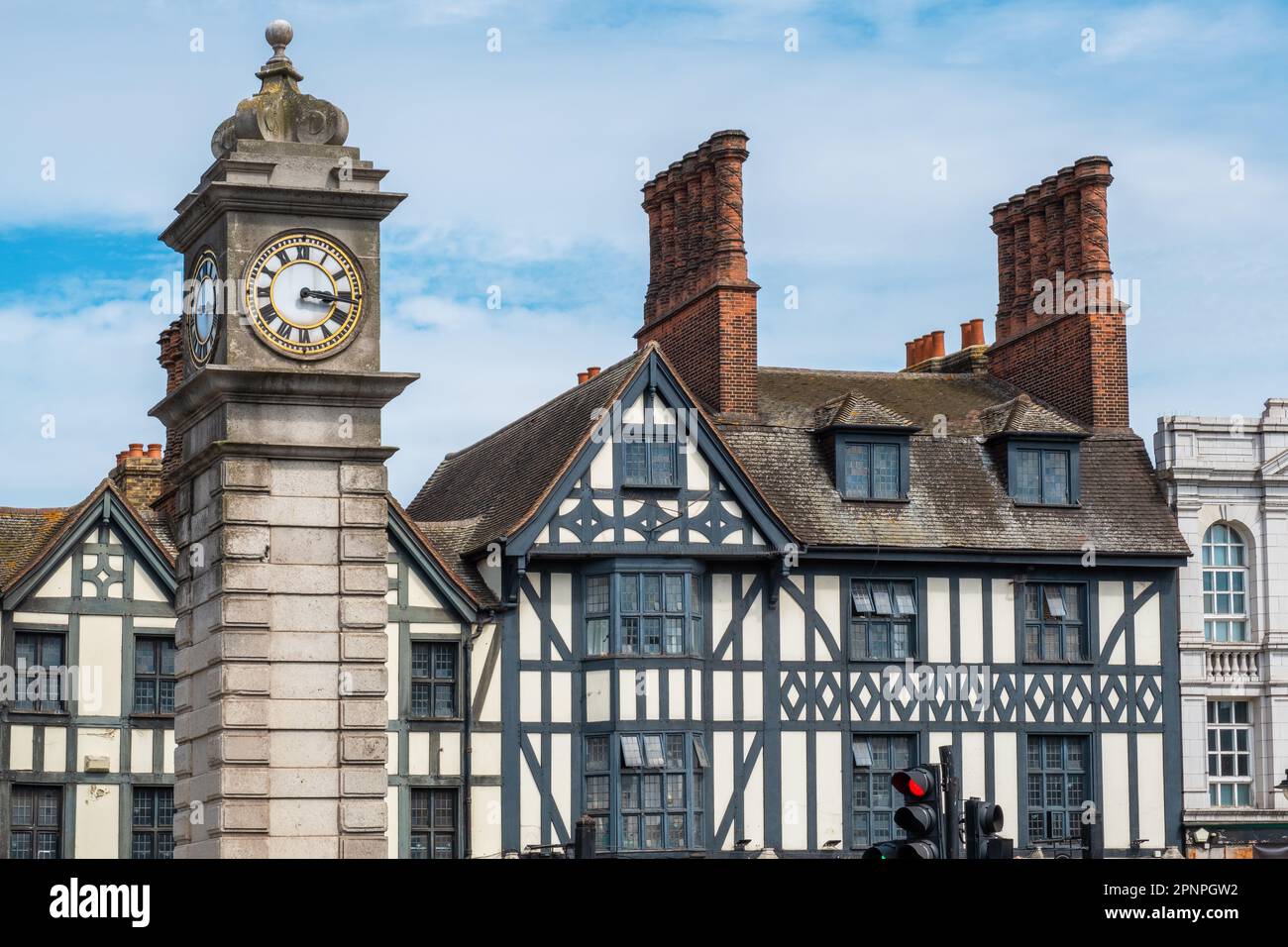 Victorian clock tower next to the half-timbered buildings in Clapham district. London, England Stock Photo