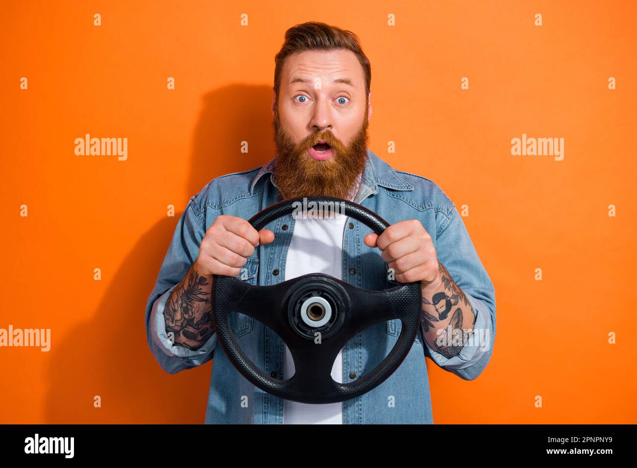 Photo of excited hipster guy irish driver hold steering wheel his first