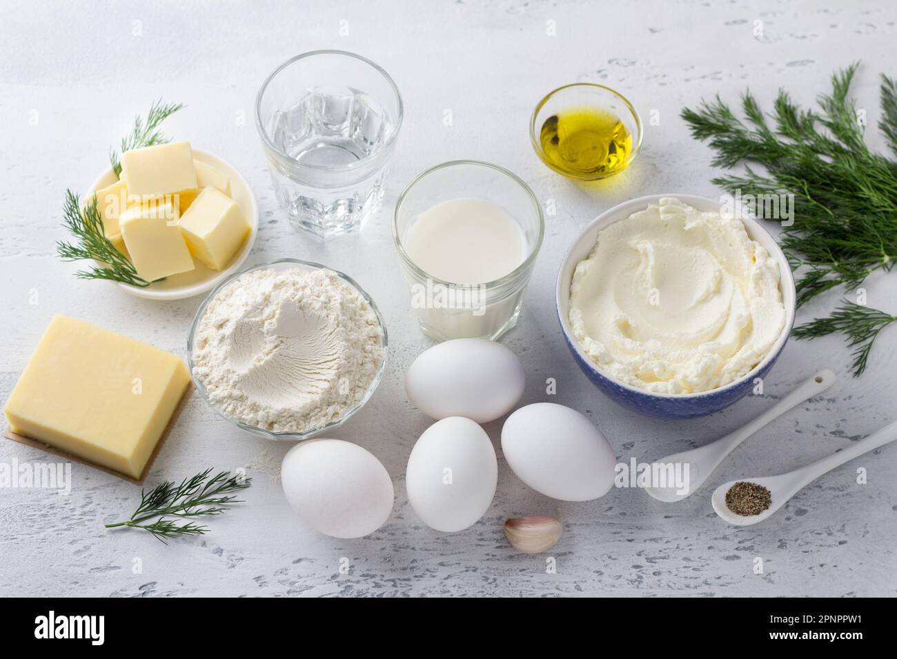 Ingredients for cooking cheese gougères stuffed with cream cheese and