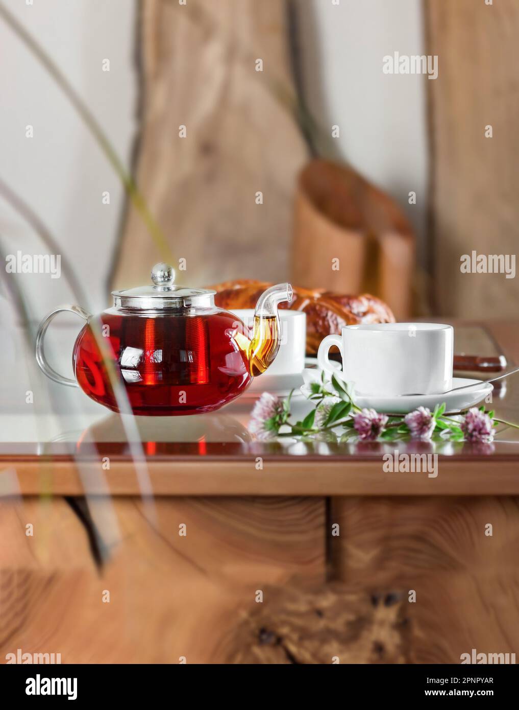 Teapot, cup and cake on the table. Stock Photo
