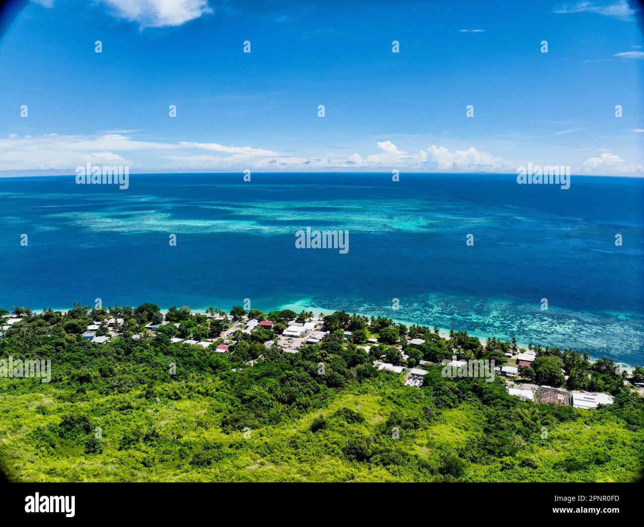 Aerial view of tropical island with clear blue water in Torres Strait, Murray Island, Stock Photo