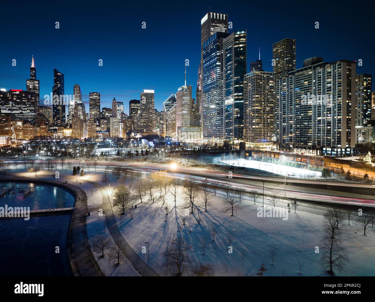 Aerial city skyline and DuSable Lake at night, Chicago, Illinois, USA Stock Photo