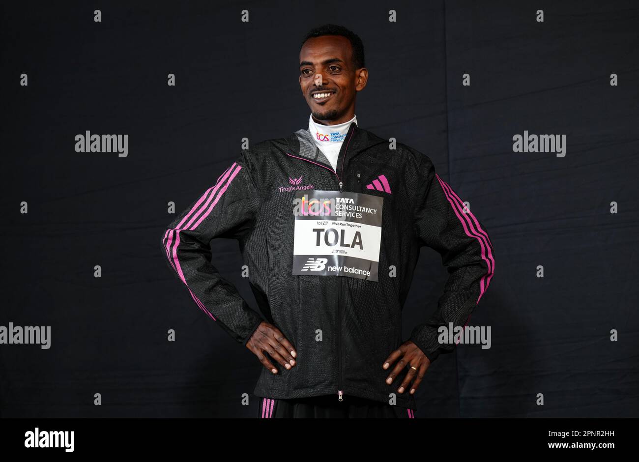 Tamirat Tola poses for photographers before a press conference in London ahead of the TCS London