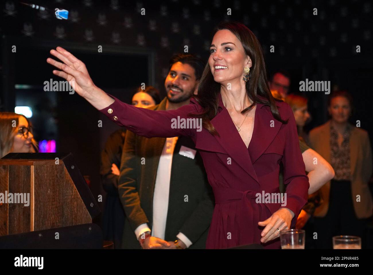 The Princess of Wales takes part in a game of interactive darts in the 180 Club during a visit to The Rectory, Birmingham. Picture date: Thursday April 20, 2023. Stock Photo