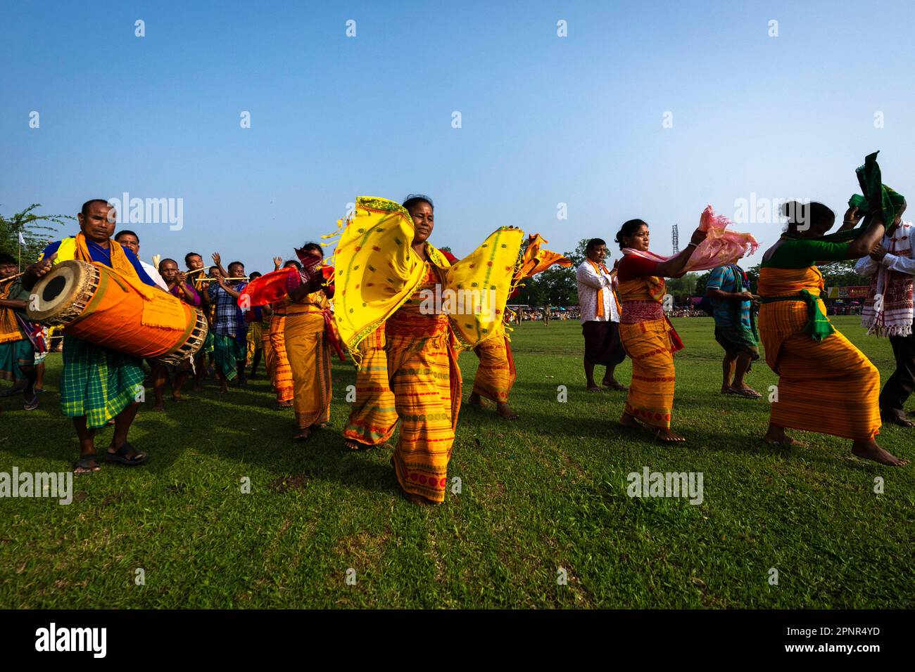 Bodo tribal people in traditional attire perform Bodo dance during