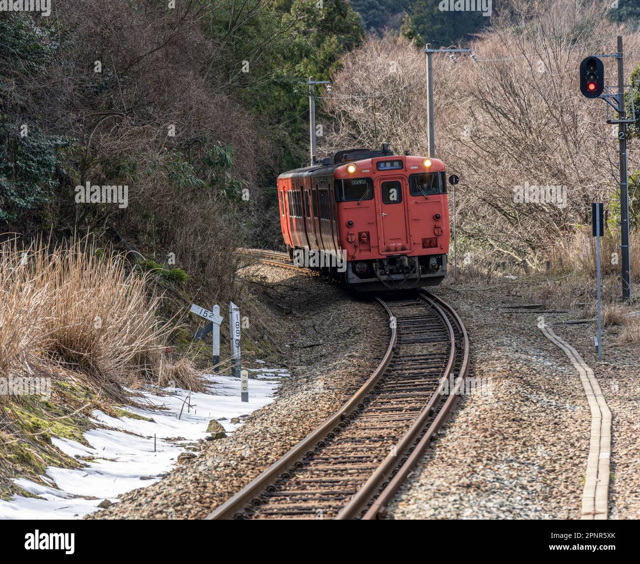 A JR West KiHa 47 Series train approaching Amarube Station on the Sanin Main Line in Hyogo Prefecture, Japan. Stock Photo