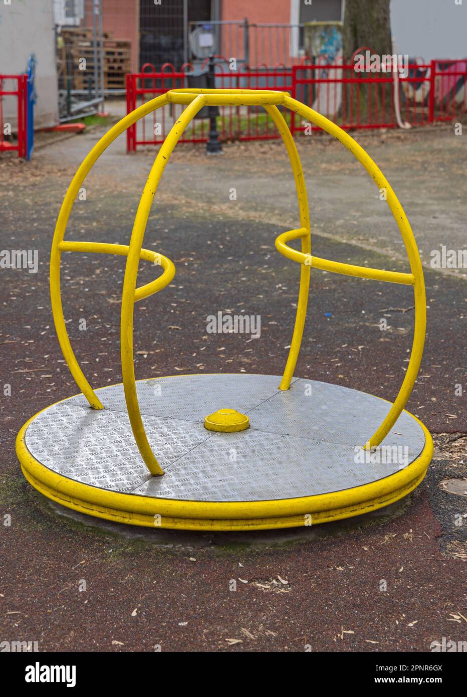 Spinning Platform With Yellow Pipes at Kids Playground Rotating Turning Stock Photo