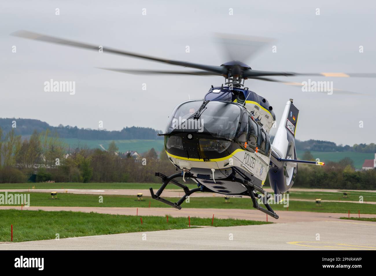 SCREENSHOT - 20 April 2023, Bavaria, Donauwörth: An Airbus H145 helicopter in the colors of the Bavarian police takes off from the Aibus Helicopters factory airfield. The Free State of Bavaria received the first two of a total of eight new aircraft ordered from Airbus Helicopters for a total of 145 million euros. Photo: Stefan Puchner/dpa Stock Photo