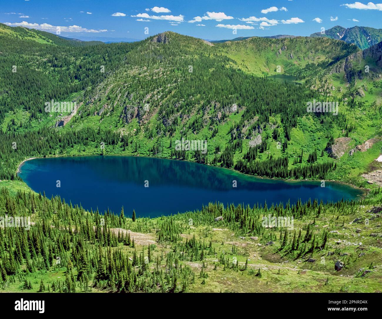 heart lake (and distant pearl lake) in the bitterroot mountains below