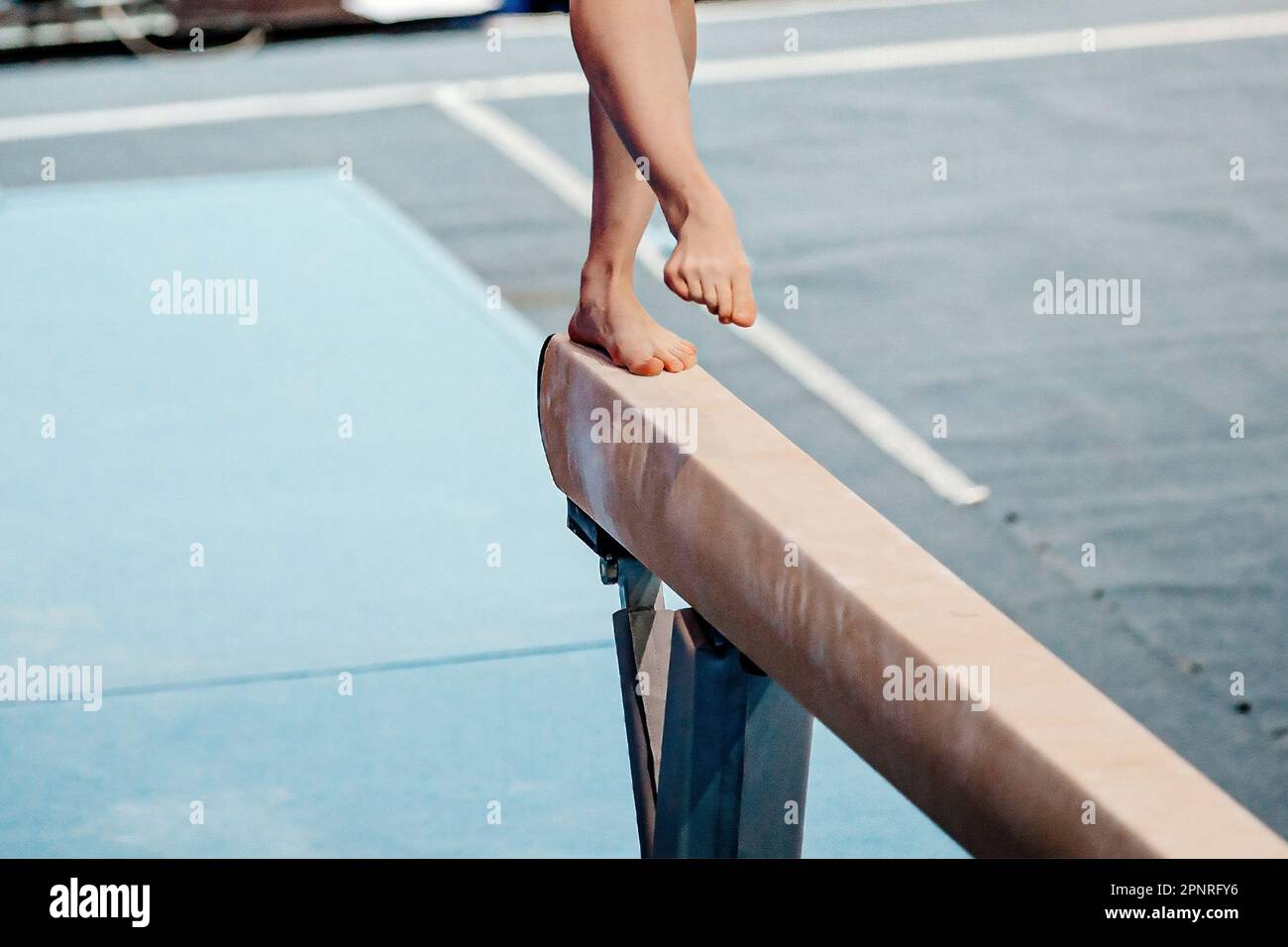front view legs female gymnast step on balance beam in gymnastics