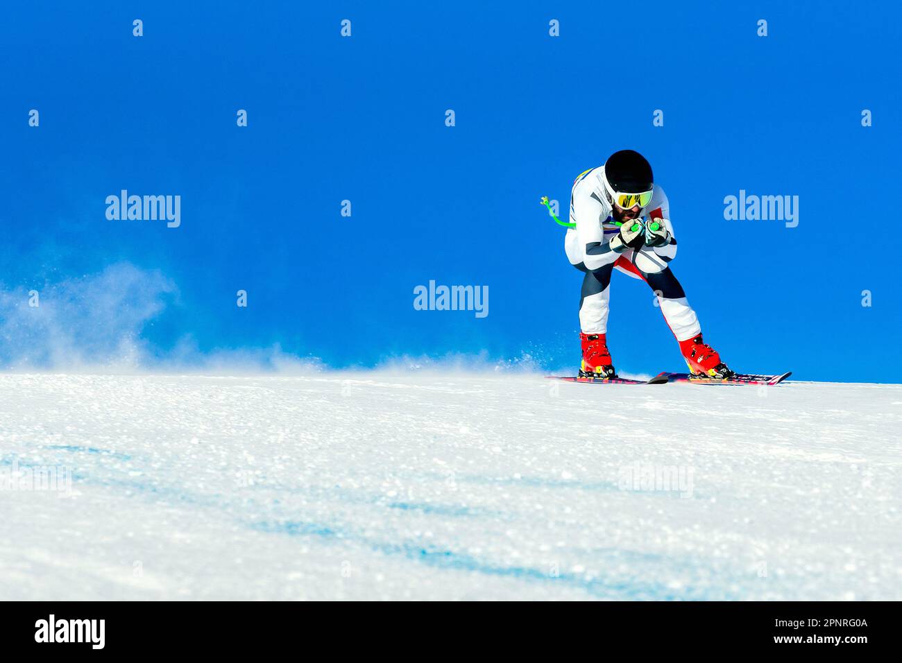male ski racer on alpine skiing track downhill race, winter sports games Stock Photo