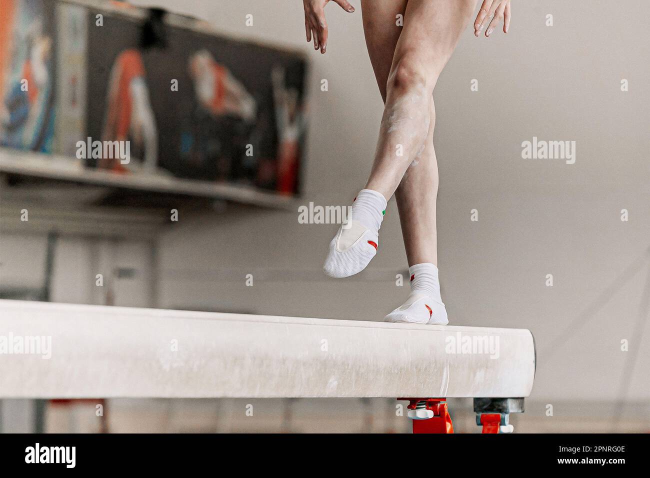 legs female gymnast step on balance beam in artistic gymnastics, sports summer games Stock Photo