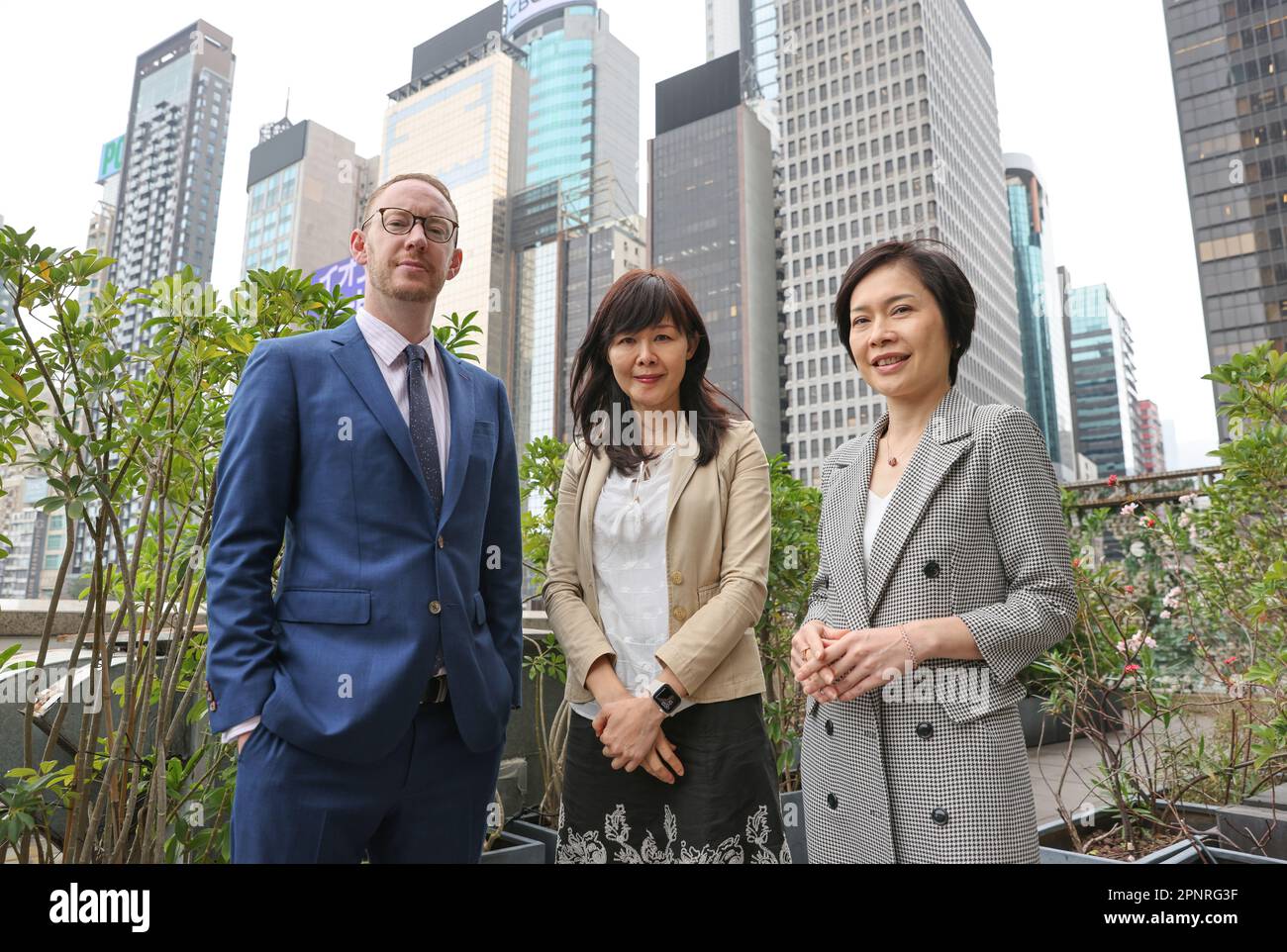 (L to R) Edward Moncreiffe, Chairman of the Hong Kong Federation of Insurers (HKFI) Think Tank on Reinventing Hong Kong's International Insurance Hub; Winnie Wong, Chairman of HKFI; and Selina Lau, Chief Executive of HKFI, pose for photo in Wan Chai.     13APR23  SCMP / May Tse Stock Photo