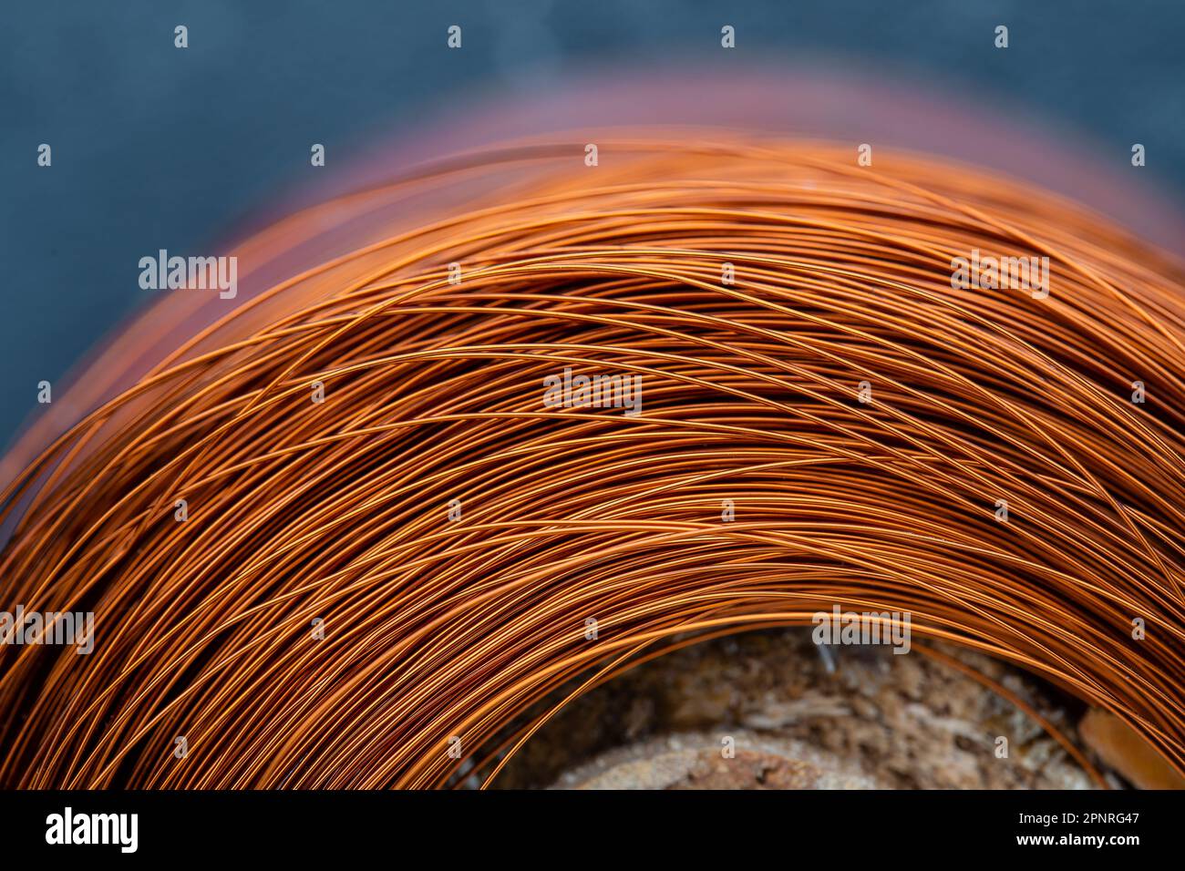 Metal texture of a coil of copper wire, closeup. Coil of thin copper