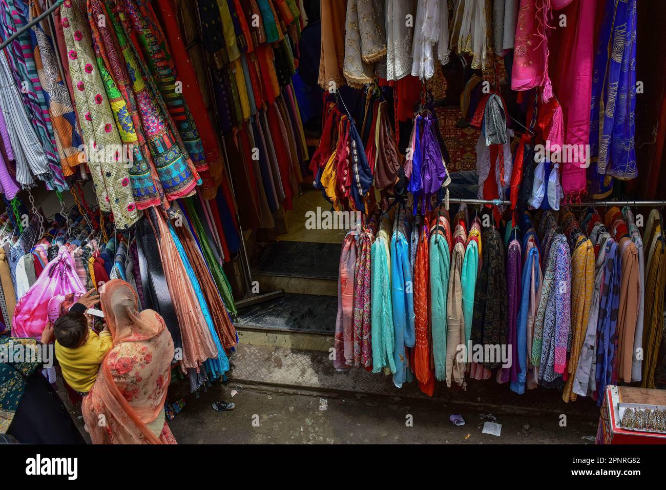 Srinagar, Kashmir, India. 20th Apr, 2023. A Kashmiri woman shops for