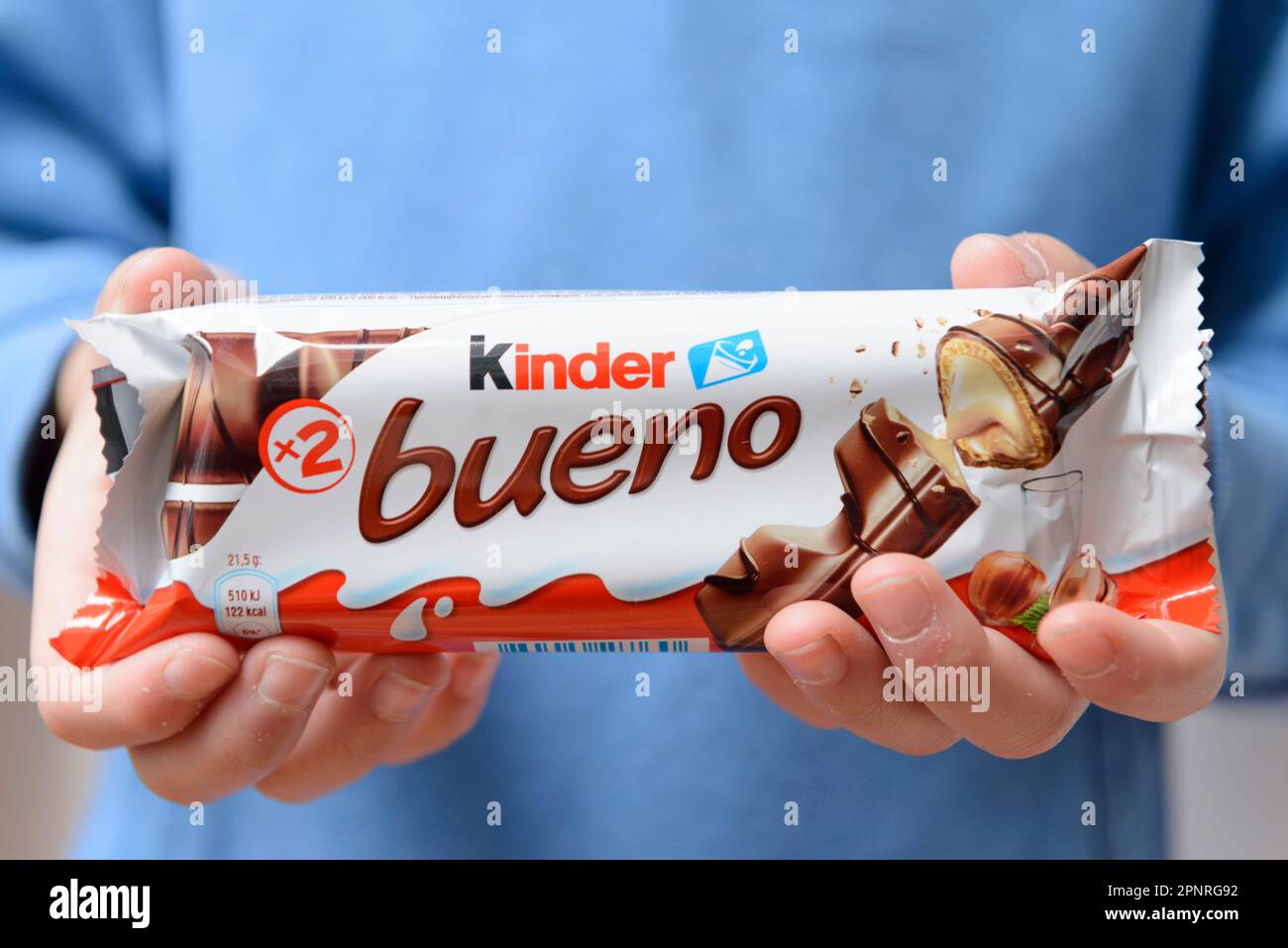 https://c8.alamy.com/comp/2PNRG92/arahal-seville-spain-march-18-2023-close-up-of-a-childs-hands-holding-a-candy-bar-from-the-brand-kinder-bueno-excessive-consumption-of-sugar-ca-2PNRG92.jpg