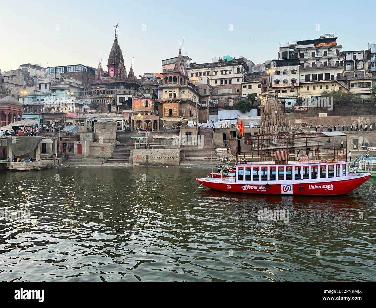 Evening boat cruise along the ghats of Ganga river at Varanasi in India Stock Photo