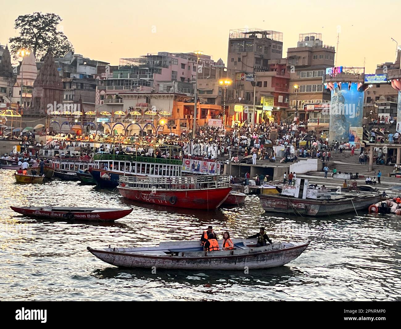 Evening boat cruise along the ghats of Ganga river at Varanasi in India Stock Photo