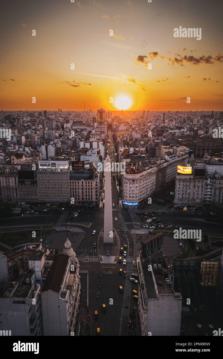 Drone shot of city scape of the obelisk in Buenos Aires city at sunset. Stock Photo