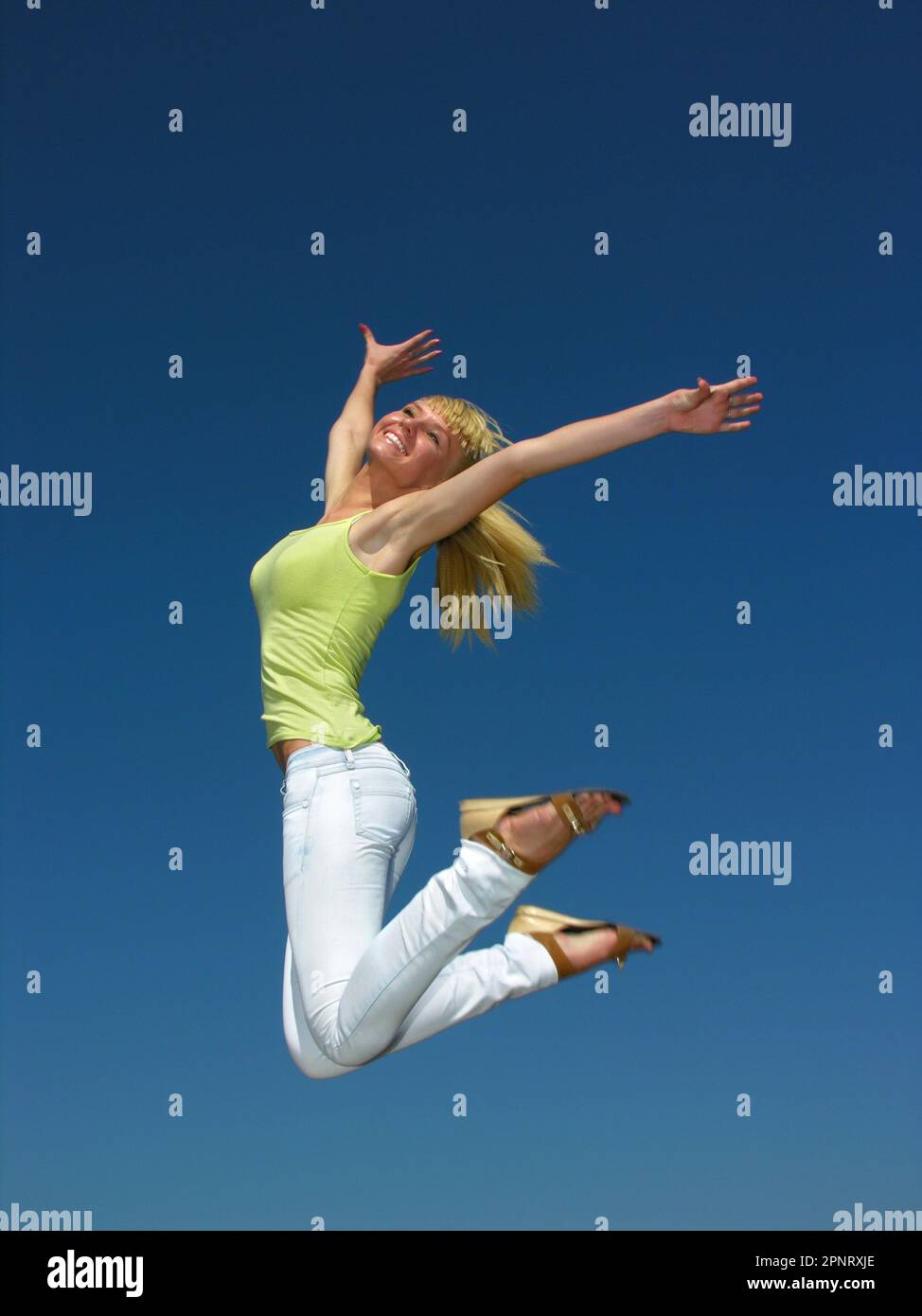 girl flying in the sky in sunny day Stock Photo