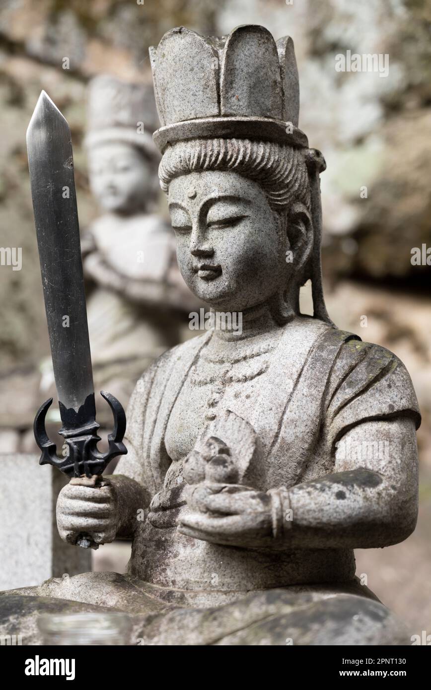 A statue holding a sword at Senkoji, a Buddhist temple in Onomichi