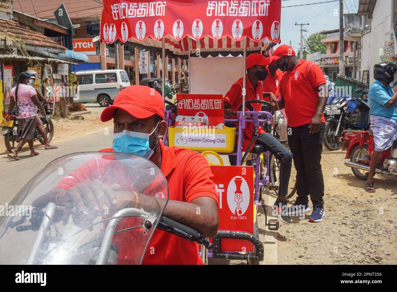 Ranjithraj Nishakaran advertises the magazine Siriththiran with a promotion team in Chavakachcheri, Jaffna, Sri Lanka on July 21, 2021. The magazine, which was relaunched in January 2021, was founded in 1963 and circulated for 32 years before its offices were burned down during the Sri Lankan Civil War. (Vijayatharsiny Thinesh/Global Press Journal) Stock Photo