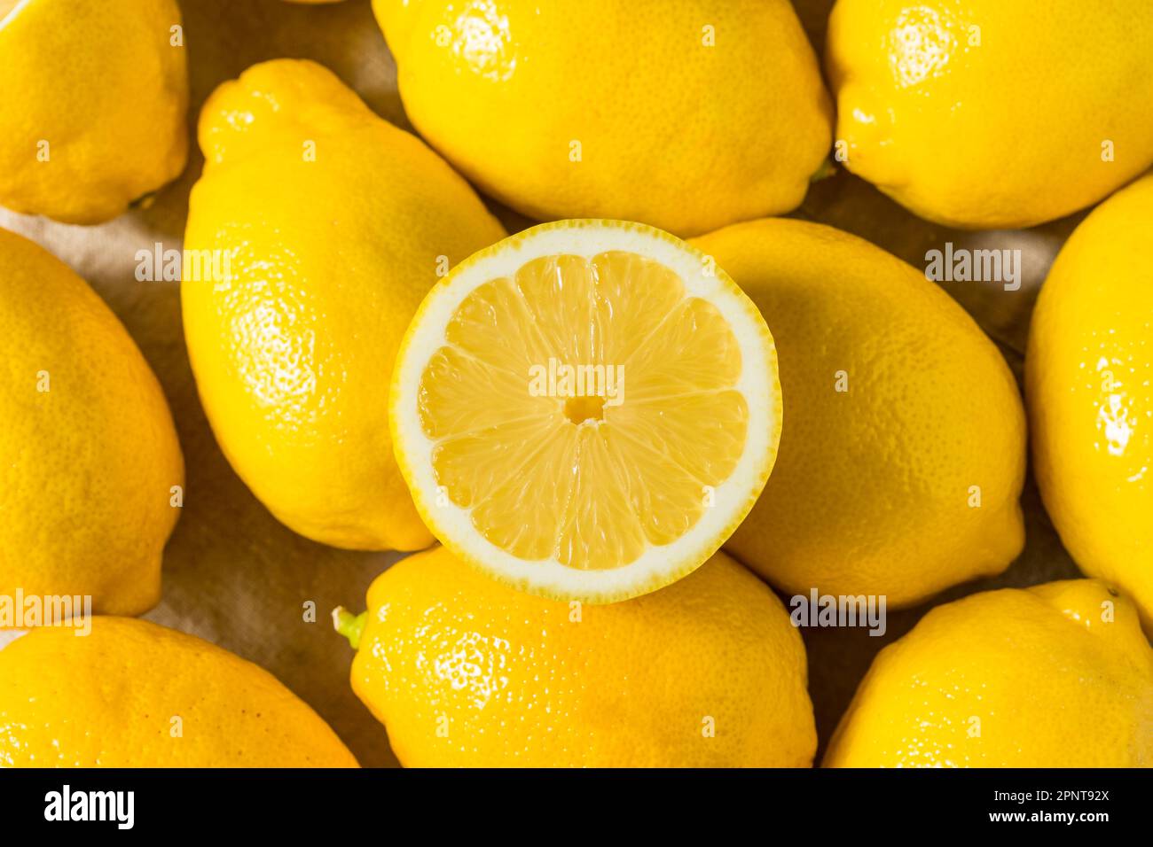 Organic Raw Seedless Yellow Lemons in a Bunch Stock Photo