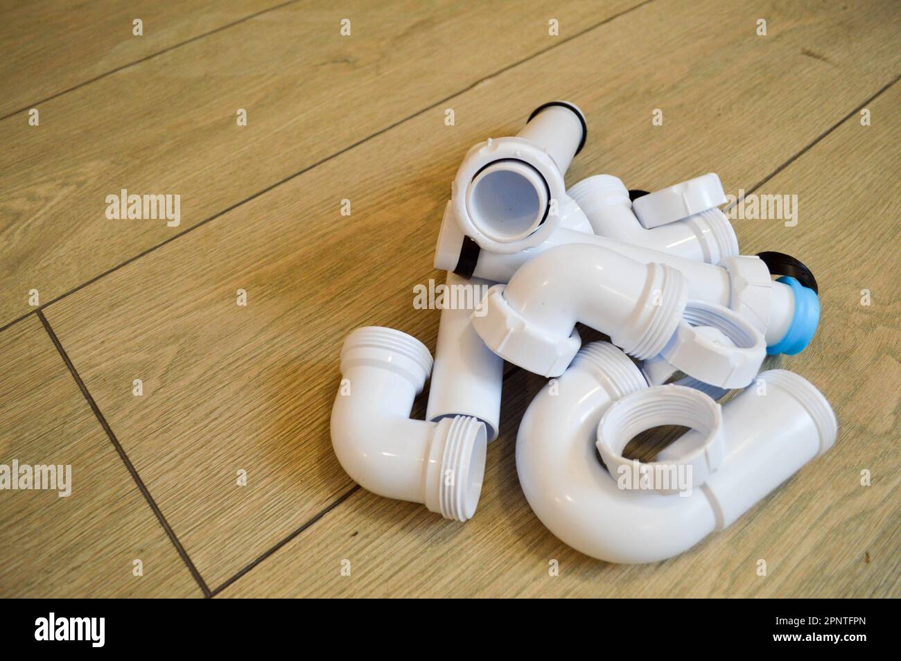 White plastic plumbing, plumbing pipes, smooth and curved, fittings