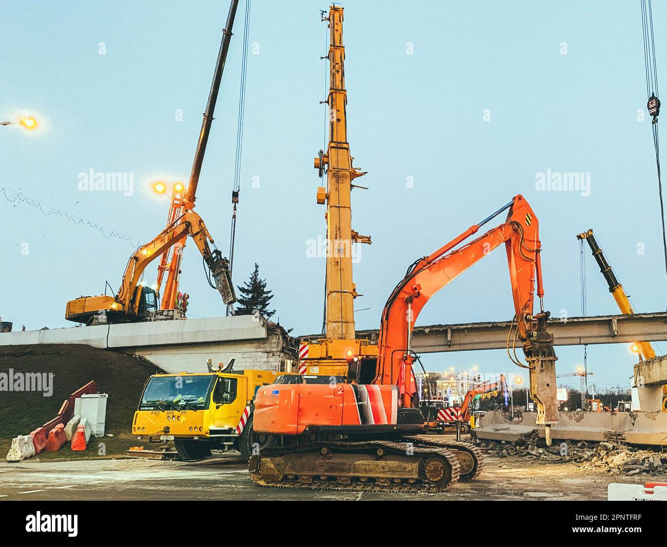 construction of a broken bridge on a busy road. the chipper makes a