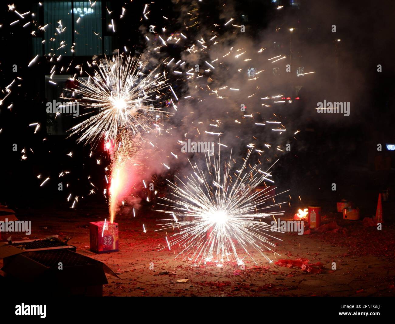 Aerial view of a spectacular outdoor fireworks display, with colorful 