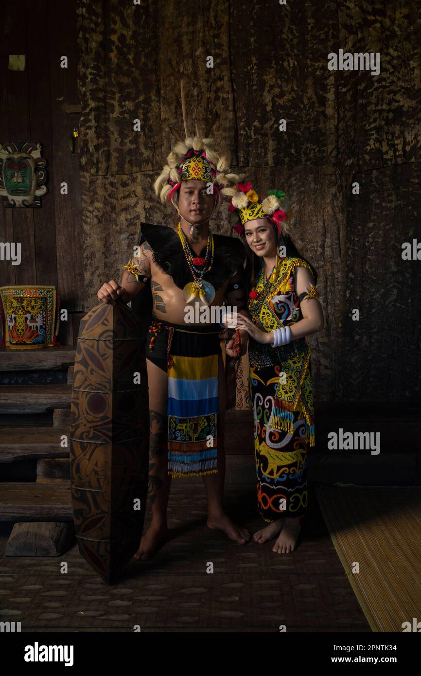 Exquisite elegance in traditional attire: A Borneo couple showcasing ...