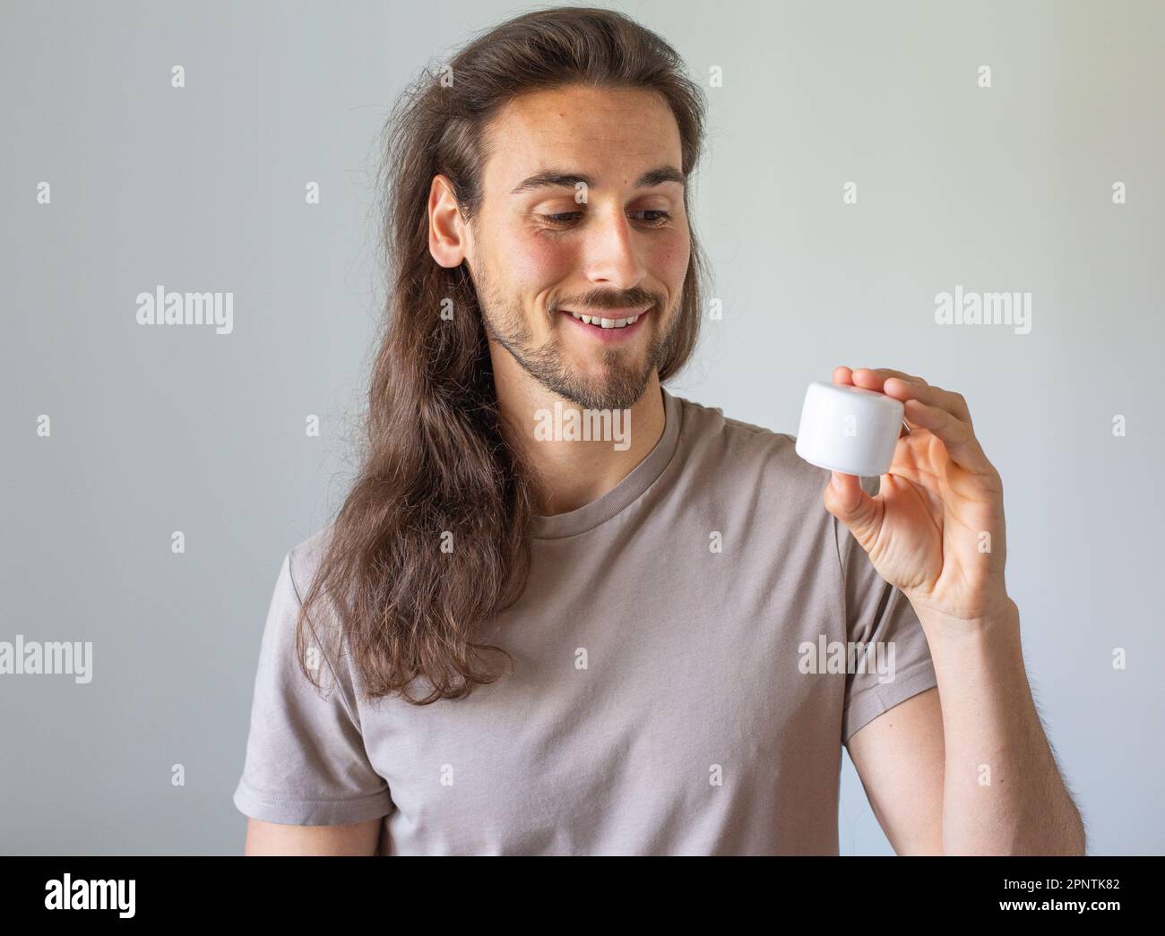 Long hair man face care Stock Photo Alamy