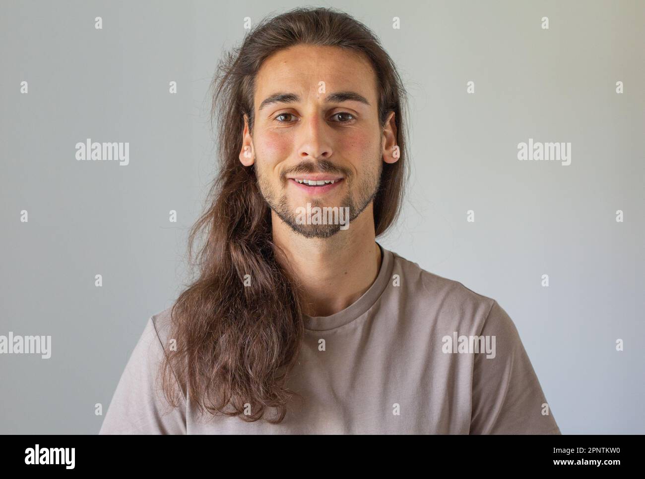 Long hair man face care Stock Photo Alamy