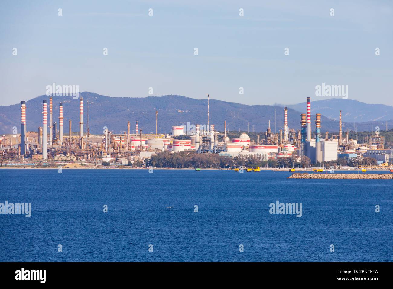 The refieria San Roque, petrochemical refinery on the Bay of Algeciras, Spain. Seen from The British Overseas Territory of Gibraltar, the Rock of Gibr Stock Photo