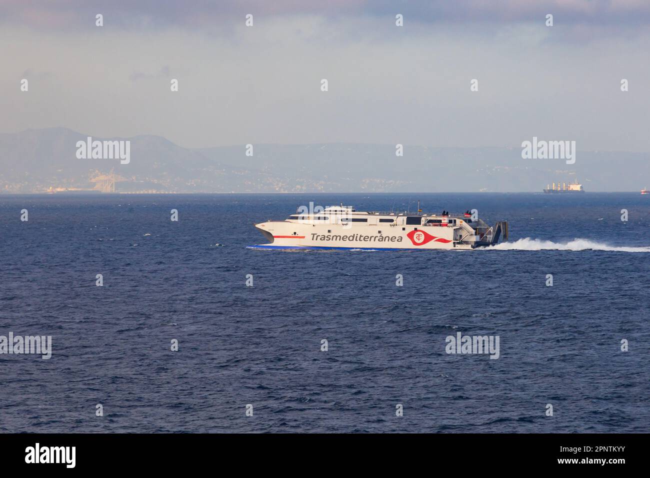 Trasmediterranea fast ferry, Ciudad de Ceuta, leaves the port of Algeciras, Spain bound for Ceuta in Northern Africa. Across the Strait of Gibraltar. Stock Photo