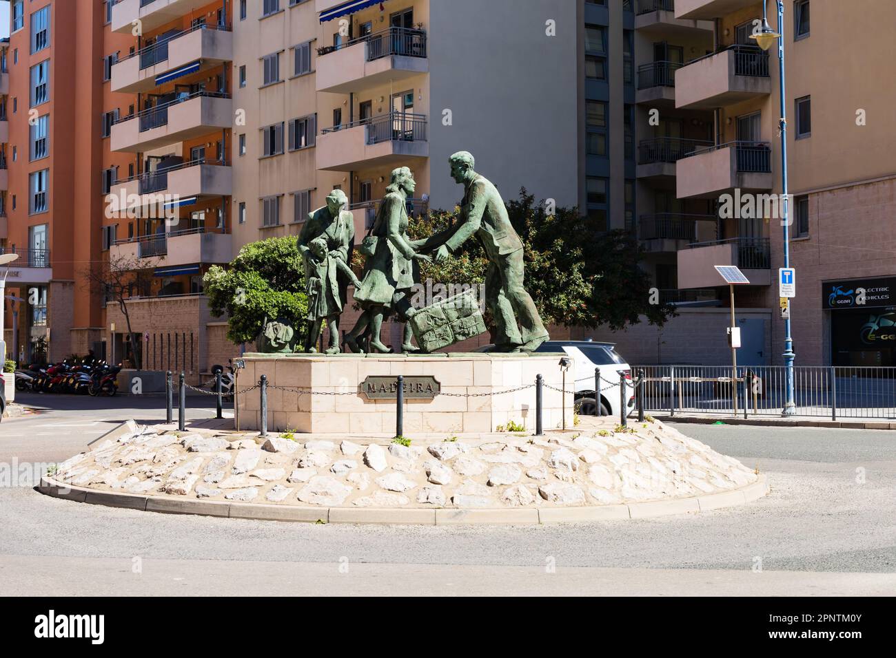 Evacuation of the Gibraltarians bronze statue by Jill Cowie Sanders. North Mole road roundabout. The British Overseas Territory of Gibraltar, the Rock Stock Photo