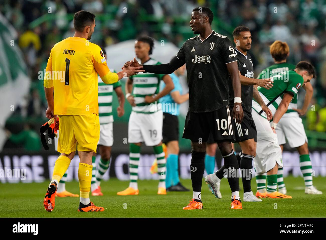Juventus' Paulo Pogba, right, greets Sporting's goalkeeper Antonio Adan at  the end of the Europa League quarter final second leg soccer match between  Sporting CP and Juventus at the Alvalade stadium in
