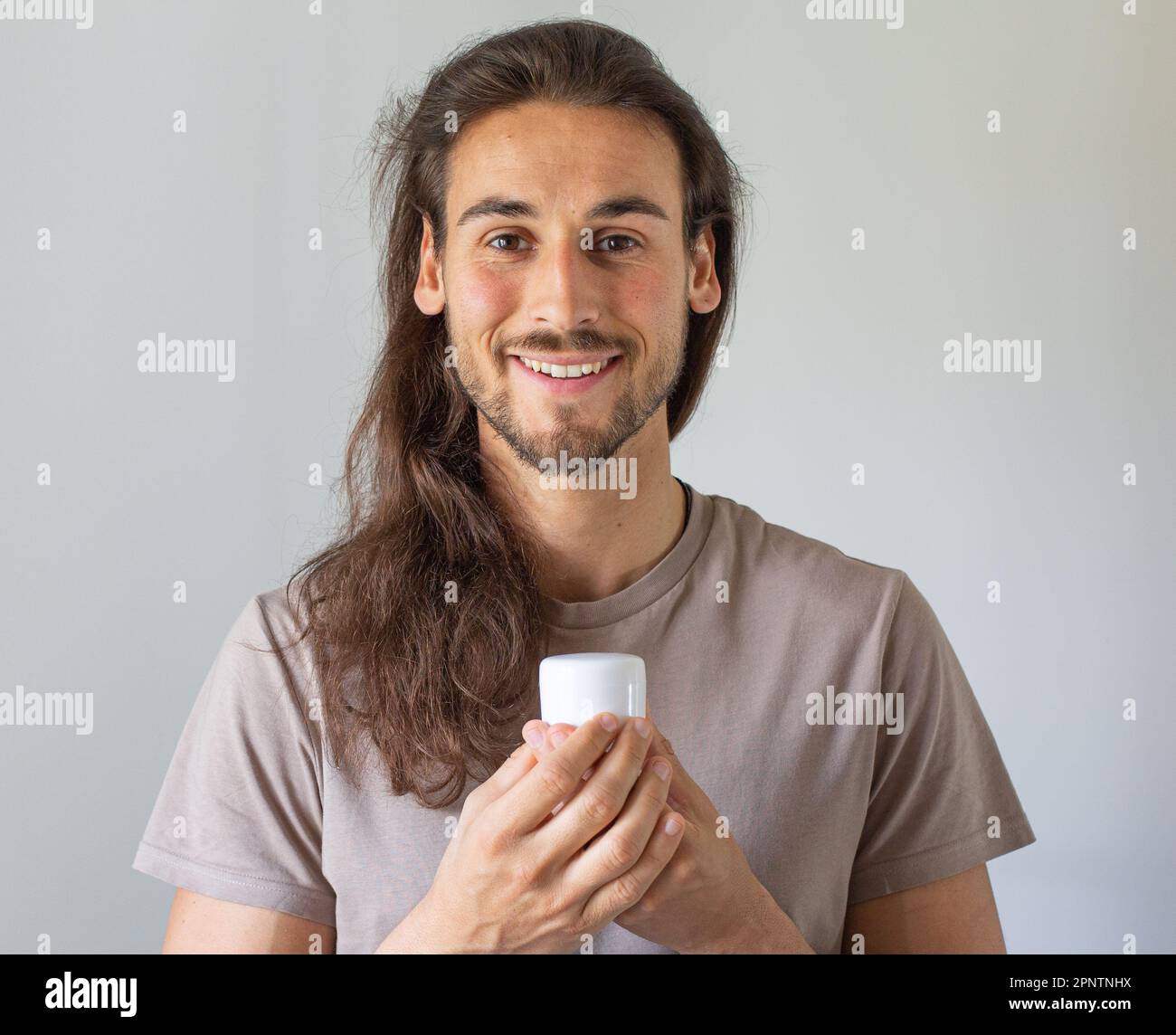 Long hair man face care Stock Photo Alamy