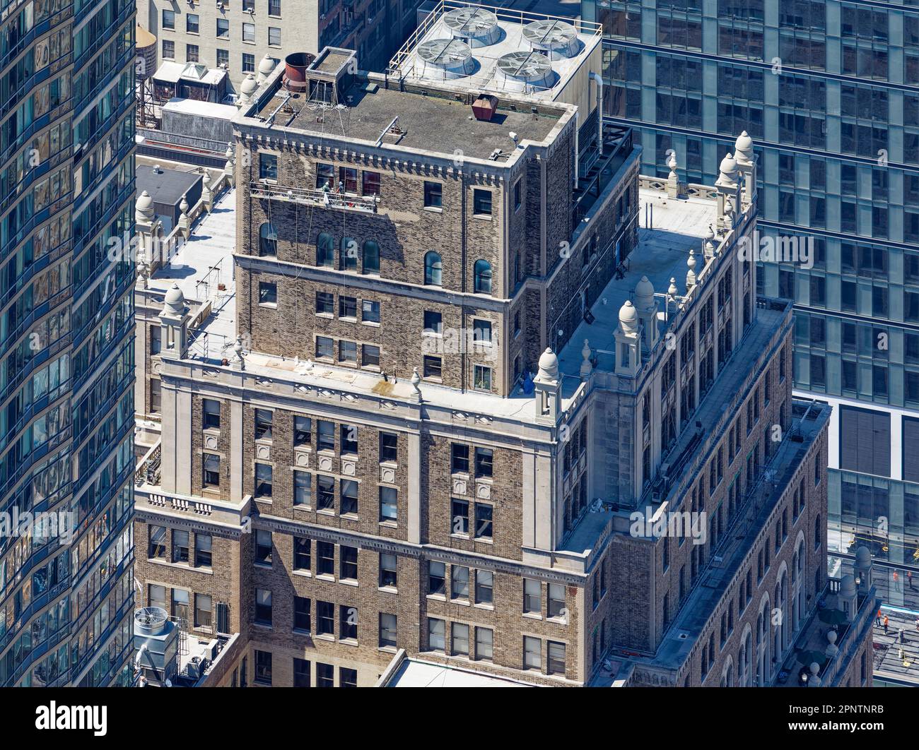 On high, classical stone details endure even as PENN 11 owners modernize the century-old Equitable Life Assurance Building in NYC’s Garment District. Stock Photo