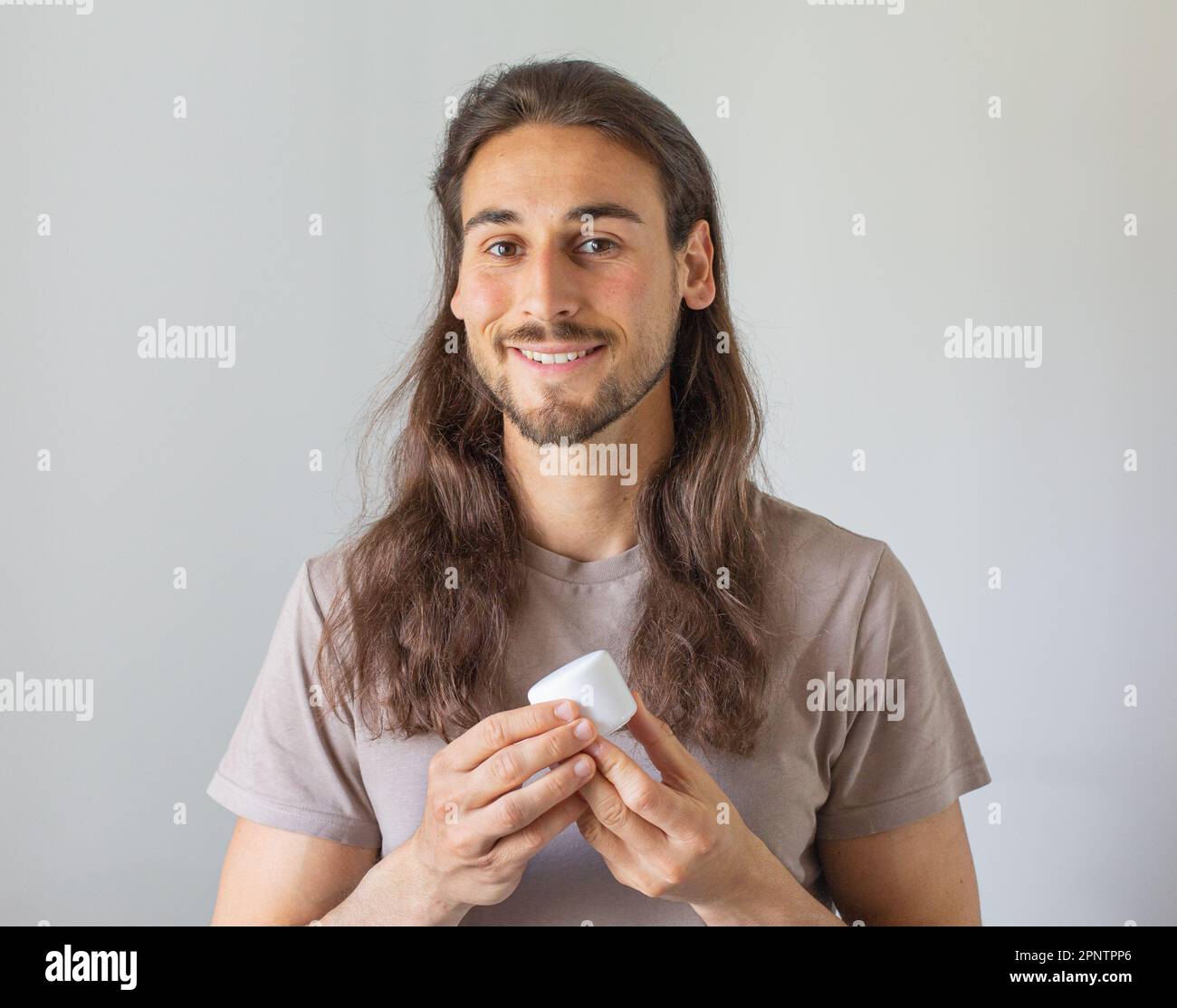 Long hair man face care Stock Photo Alamy