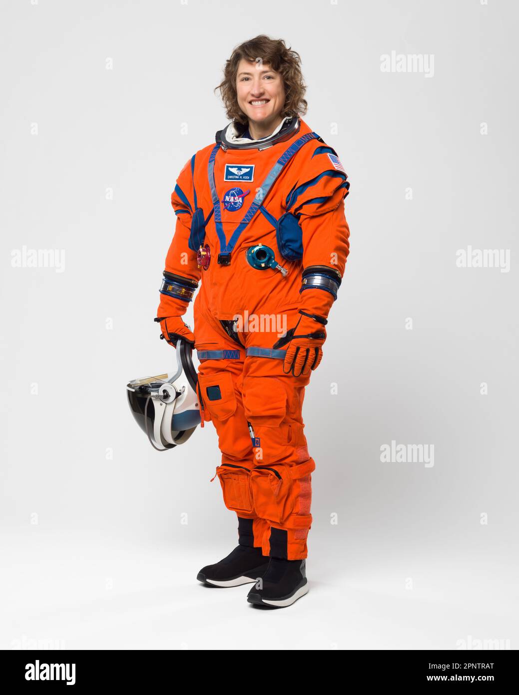 Houston, United States. 30 March, 2023.  NASA Astronaut Christina Hammock Koch and Artemis II crew member poses in the bright orange Orion Crew Survival System suit at the Johnson Space Center, March 28, 2023 in Houston, Texas. Koch was selected as a flight engineer for the Artemis II mission to the Moon.  Credit: Robert Markowitz/NASA/Alamy Live News Stock Photo