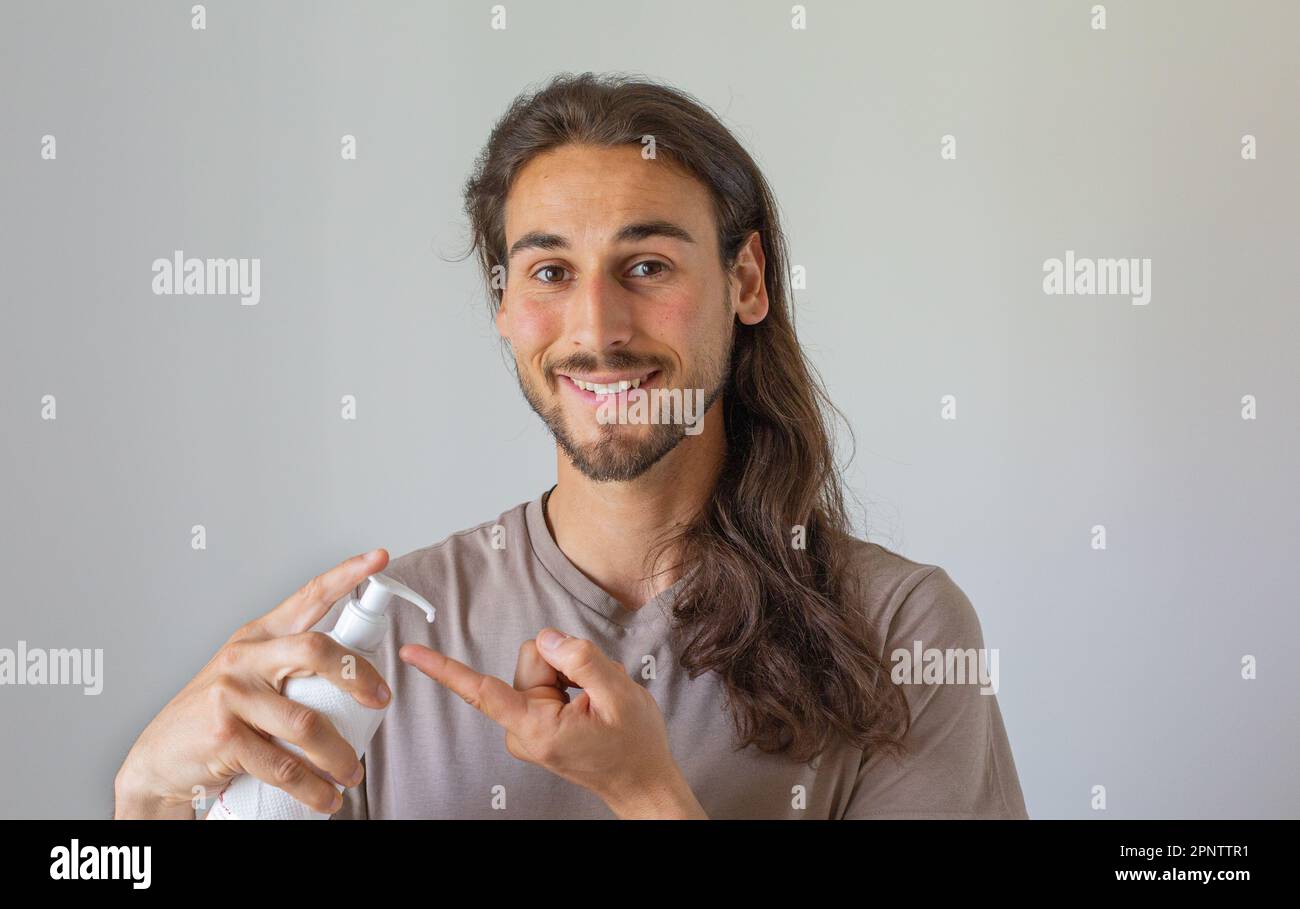 Long hair man face care Stock Photo Alamy