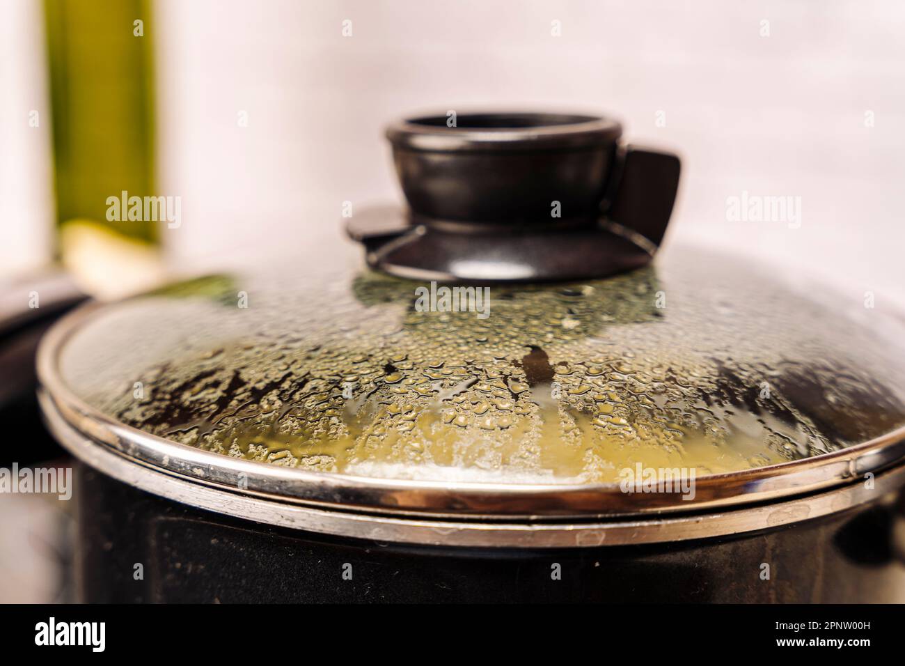 the misted lid of a pot of boiling water Stock Photo Alamy