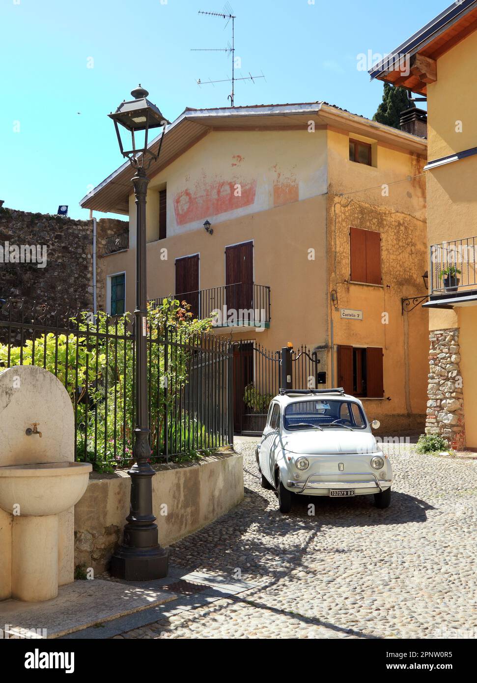 Classic car Fiat 500 L inside Castle of Moniga. Castello di Moniga del Garda. Stock Photo