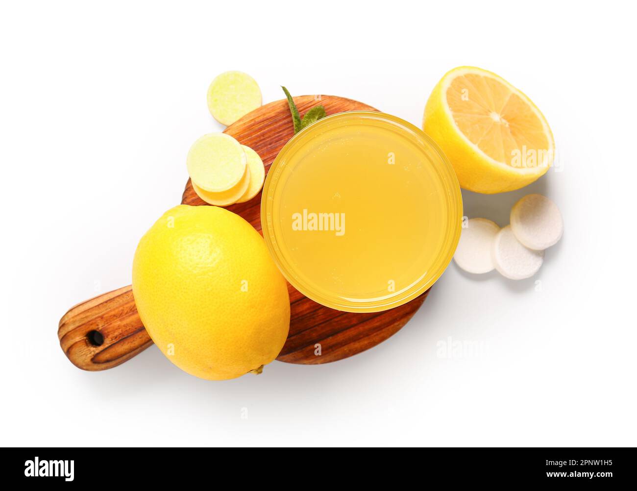Board with glass of vitamin C effervescent tablet dissolved in water